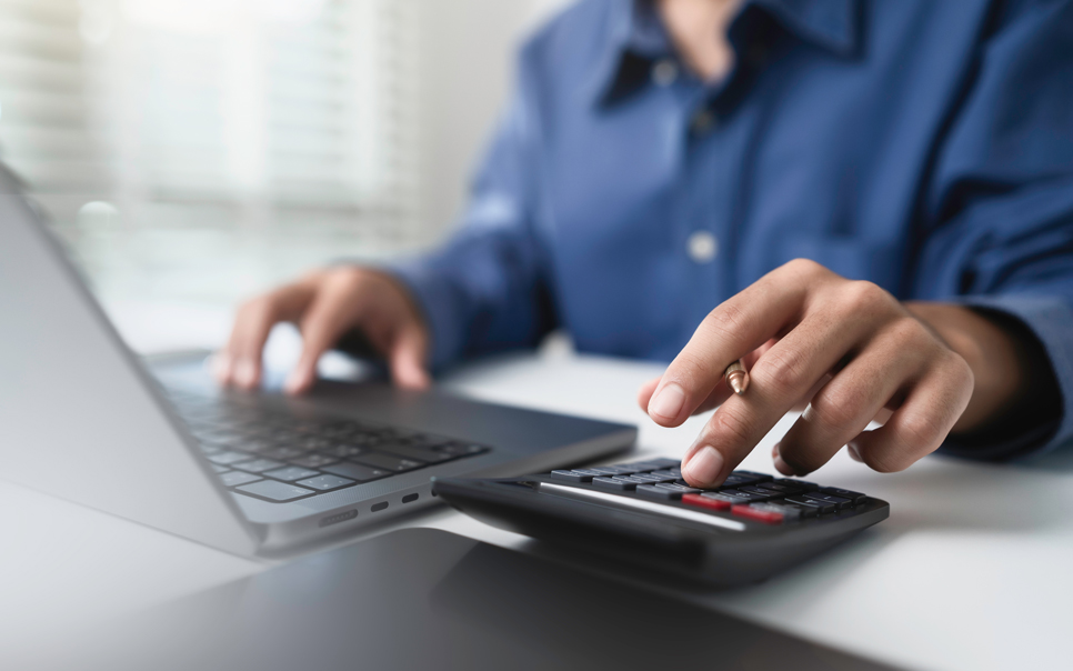Syspro tax management professional calculating taxes for manufacturing and distribution compliance using digital tools